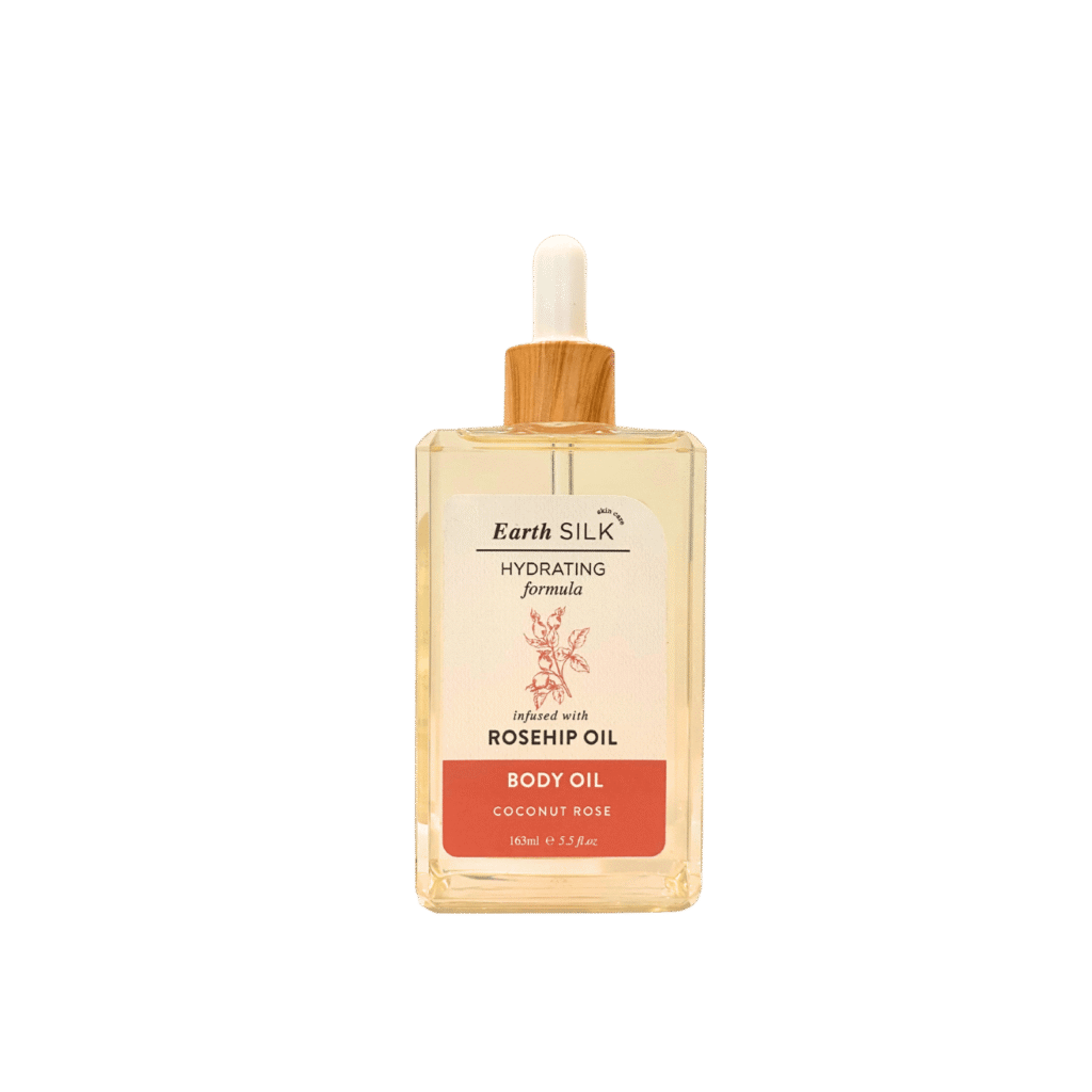 Bottle of coconut rose hydrating body oil infused with rosehip oil – floral, lightweight, and glow-boosting