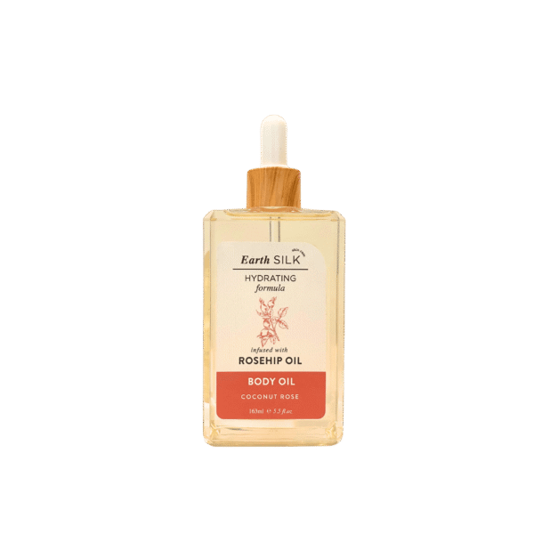 Bottle of coconut rose hydrating body oil infused with rosehip oil – floral, lightweight, and glow-boosting