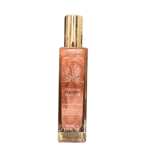 Bottle of Coconut Vanilla Shimmer Body Oil with golden shimmer and tropical background