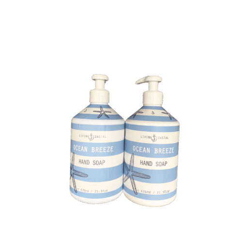 Two bottles of Living Coastal Ocean Breeze Hand Soap with ocean-inspired packaging and a clean, coastal aesthetic