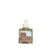 Tahitian coconut glowing body oil in a bottle – hydrating and illuminating for radiant, smooth skin