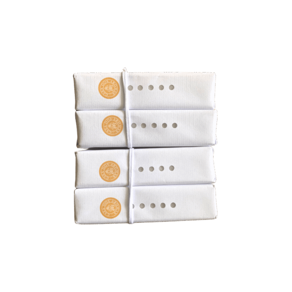 4 handcrafted Wild Honey & Goat's Milk soap bars made in Portugal, displayed in a rustic box with golden and cream tones.