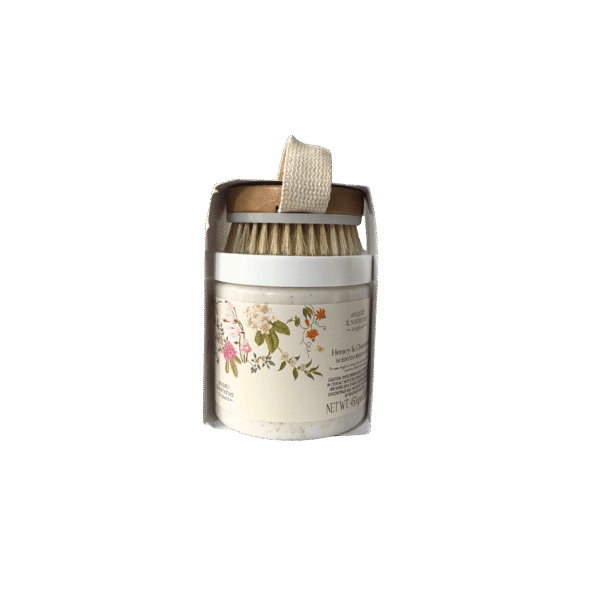Asquith & Somerset Honey & Chamomile Body Scrub jar with wooden exfoliating brush.