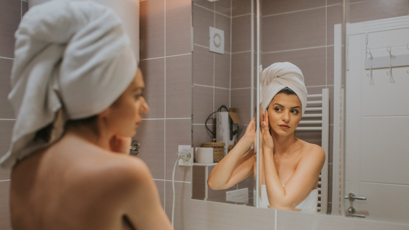 Woman enjoying an everything shower routine with glowing soft skin